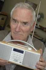 Dick Robson, 75, with his 'company' radio. Picture: Grant Falvey