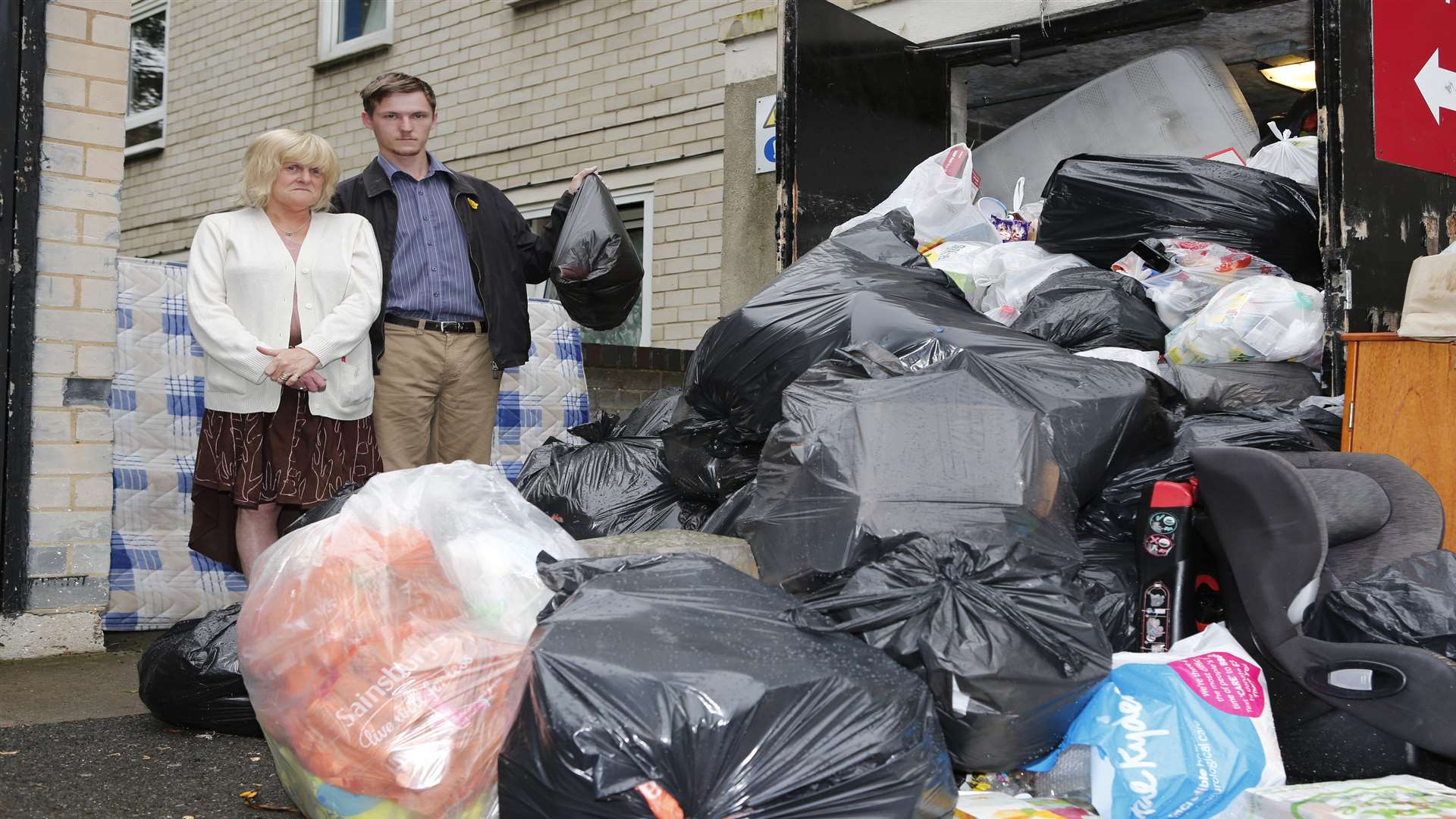 Vincent Gurr and mum Pauline by the increasing rubbish pile outside the bins at Shipley Court. Picture: Matthew Walker