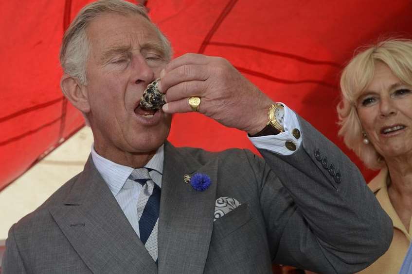 Closing his eyes, Prince Charles tastes an oyster at West's Welks. Picture: Gary Browne