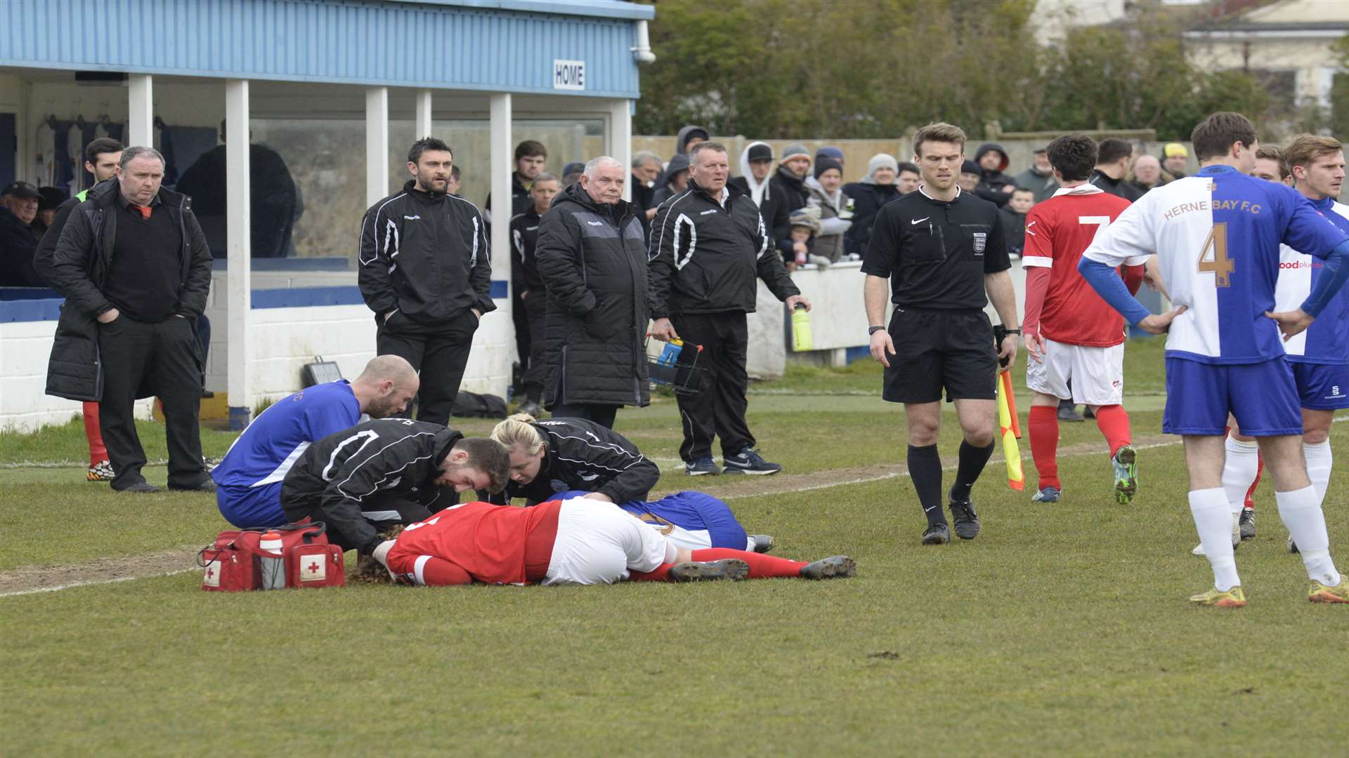 Players and officials gathered around the two injured players. Picture: Chris Davey.