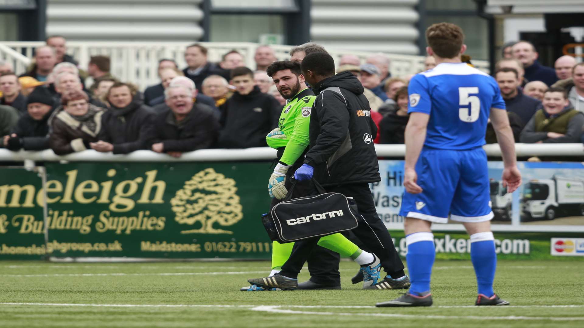 Injured Dartford goalkeeper Deren Ibrahim makes his way off at Maidstone Picture: Martin Apps