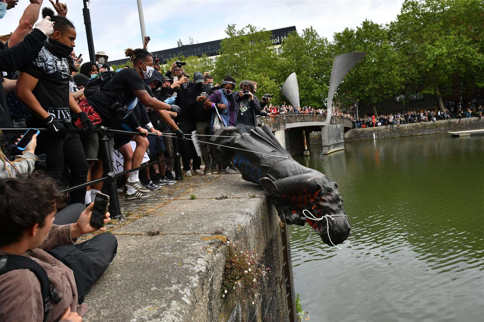 The statue of Edward Colston being thrown into Bristol Harbour during Black Lives Matter protests in June 2020 (Ben Birchall/PA)