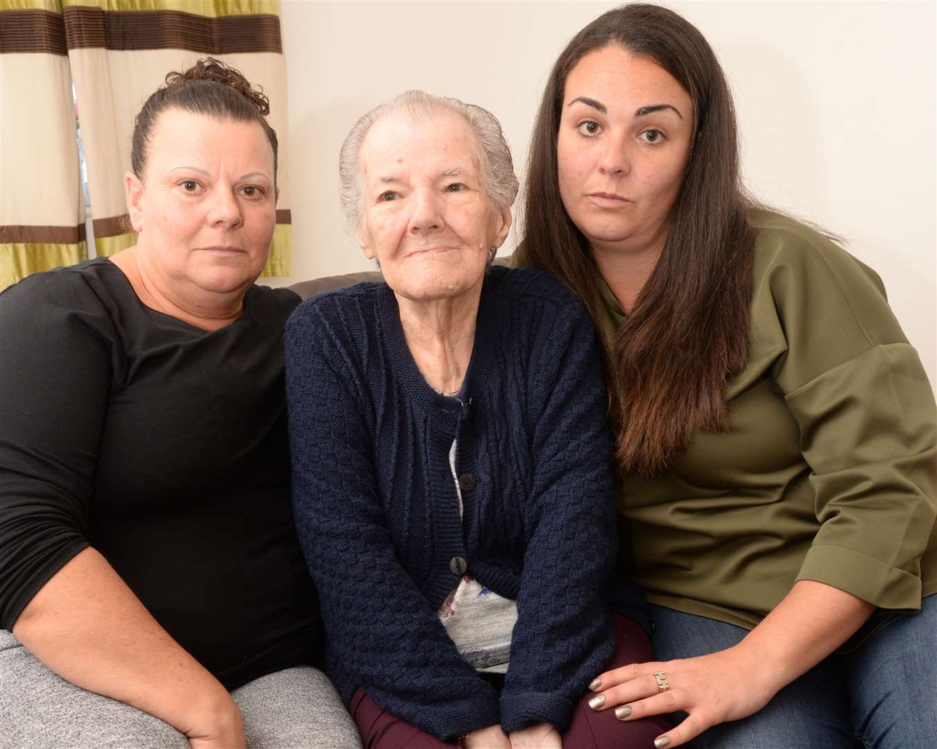 Beryl Harris, 87 of Leysdown, with daughter and granddaughter Tina and Gemma Cunningham, was locked on an Age UK bus for three hours. Picture: Chris Davey