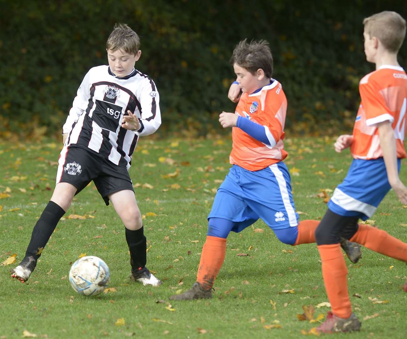 Milton & Fulston United Zebras under-13s (black/white) are closed down by Cuxton 1991 Dynamos under-13s. Picture: Barry Goodwin (42936760)