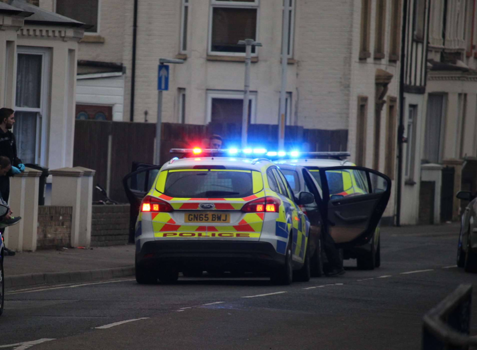 Police searching the stopped car in Trinity Road, Sheerness