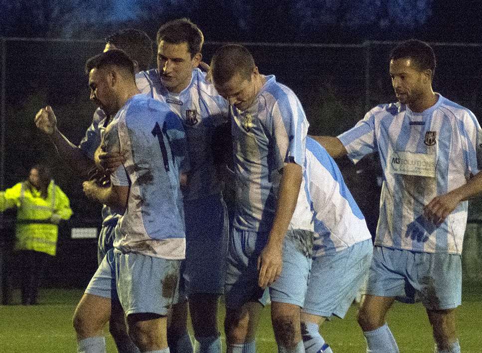 Folkestone's players celebrate one of their three goals at Merstham Picture: Don Linkin