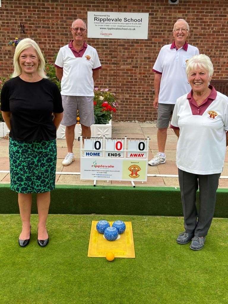 Ripplevale CEO Jane Norris hands over the new scoreboards to committee members Vic Fisher, Jim Mayo and Margaret Ryan