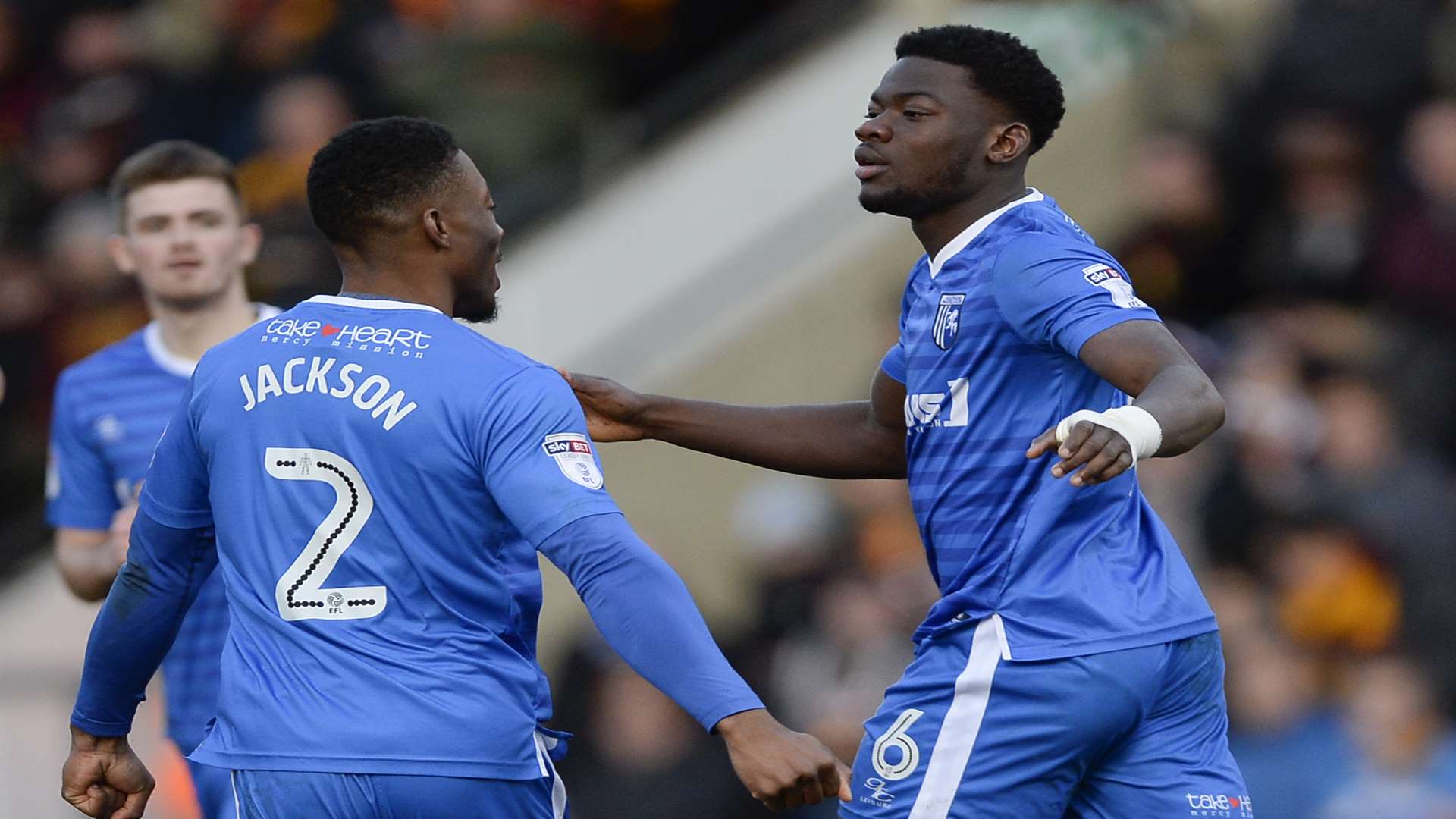 Deji Oshilaja (right) celebrates his goal at Bradford before injury ended his afternoon early Picture: Ady Kerry