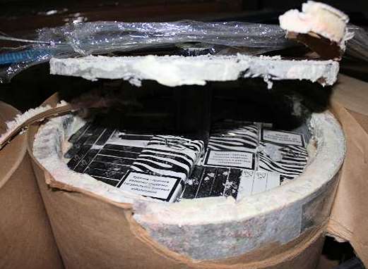 The cigarettes smuggled inside tubing with asbestos. Picture courtesy of HMRC
