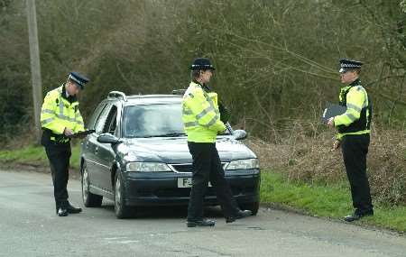 Police speaking to a motorist during Wednesday's roadside checks. Picture: GARY BROWNE