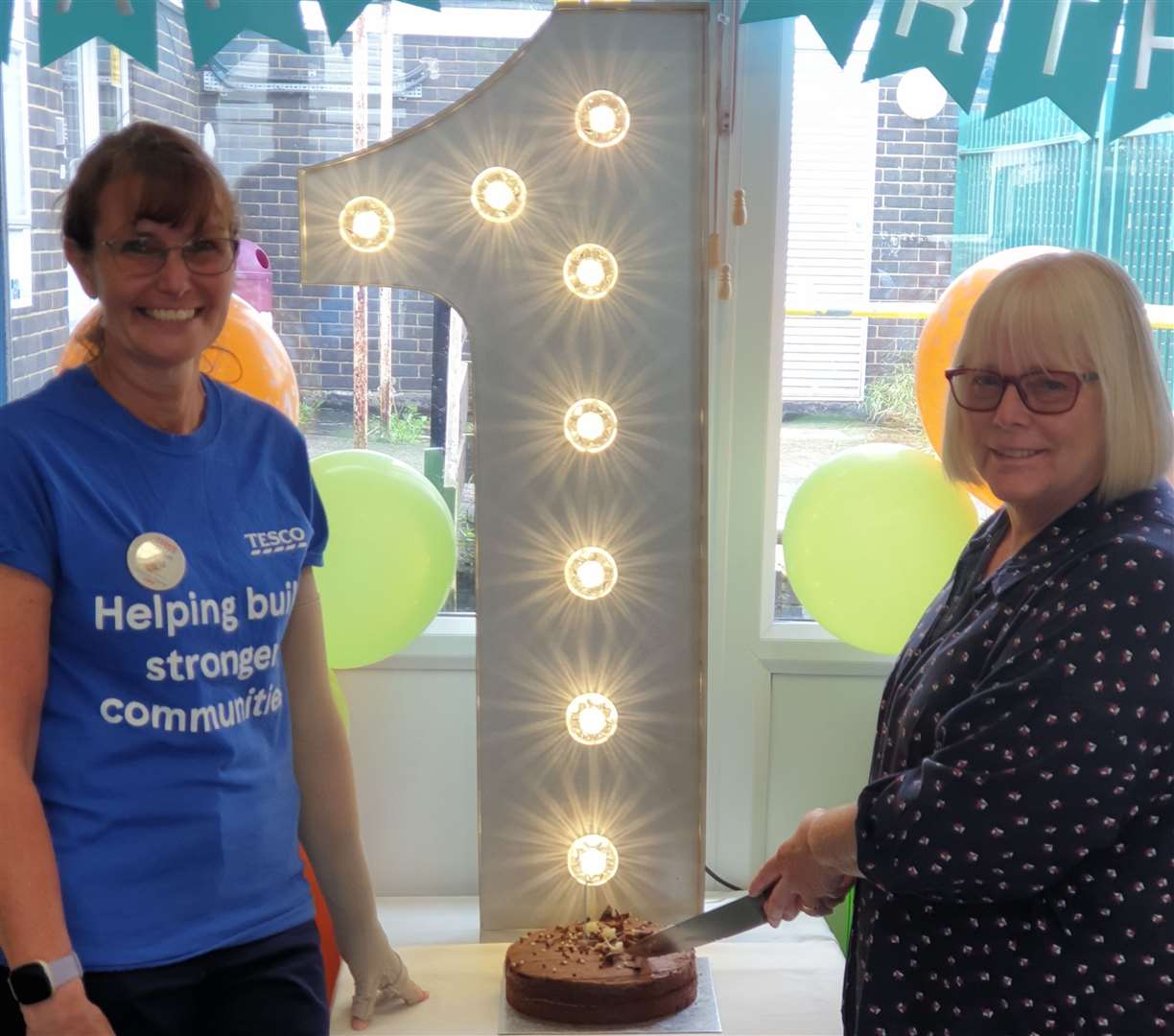 The EMC supermarket's 1st birthday with, right, Liz Simpson, chairman of trustees of The East Malling Centre, and Helen Povey, community champion of Tesco Lunsford Park