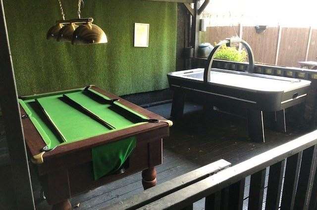 Walking through to the back garden of The Wheatsheaf you will find this covered area with a pool table and an air hockey game
