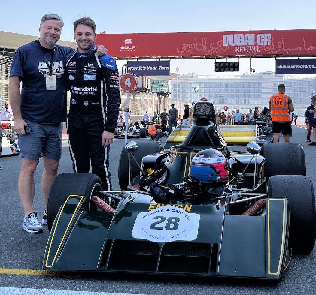Jake Hill and father Simon with the Ensign Formula 1 car he raced in Dubai. Picture: Simon Hill