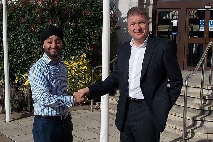 Kent County Council ICT networks functional lead Ricky Sahni, left, with ICOM group sales director Kevin Godfrey outside Kent County Council