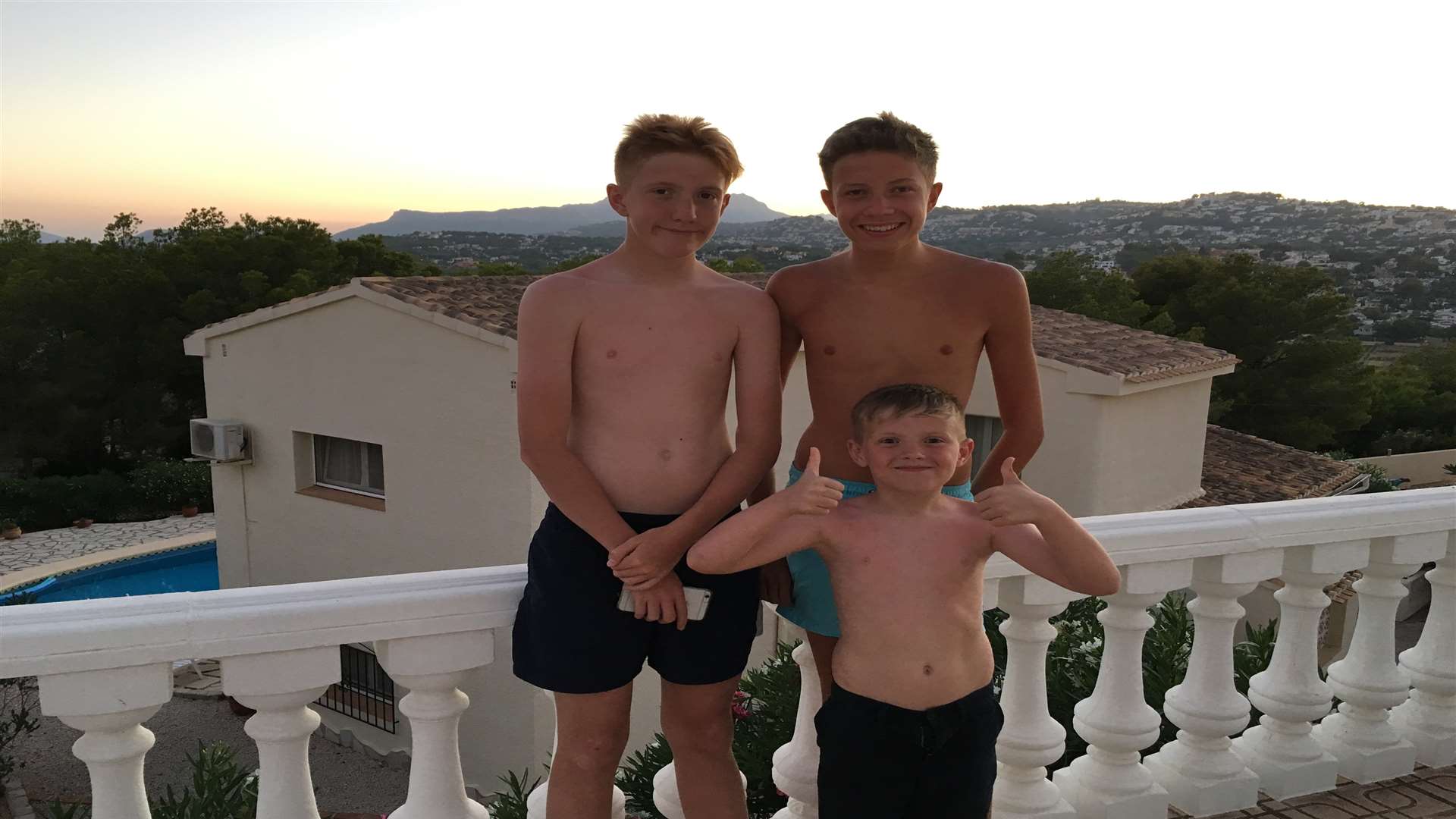 Jayden (right) with his brothers Callum and Liam