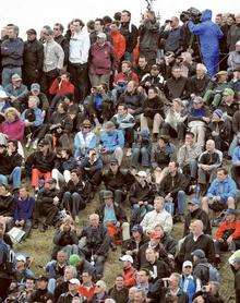 The crowds gather to watch Rory McIlroy arrive on the third