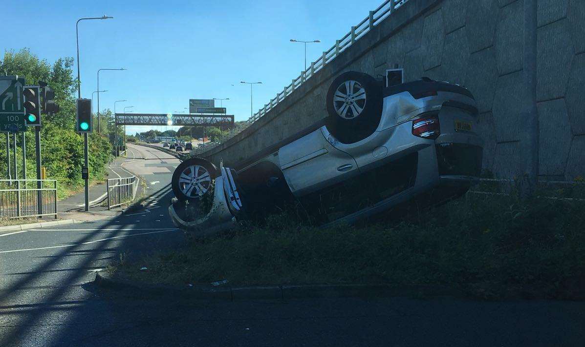 A car overturned in the accident on the Bridgewood roundabout near Blue Bell Hill