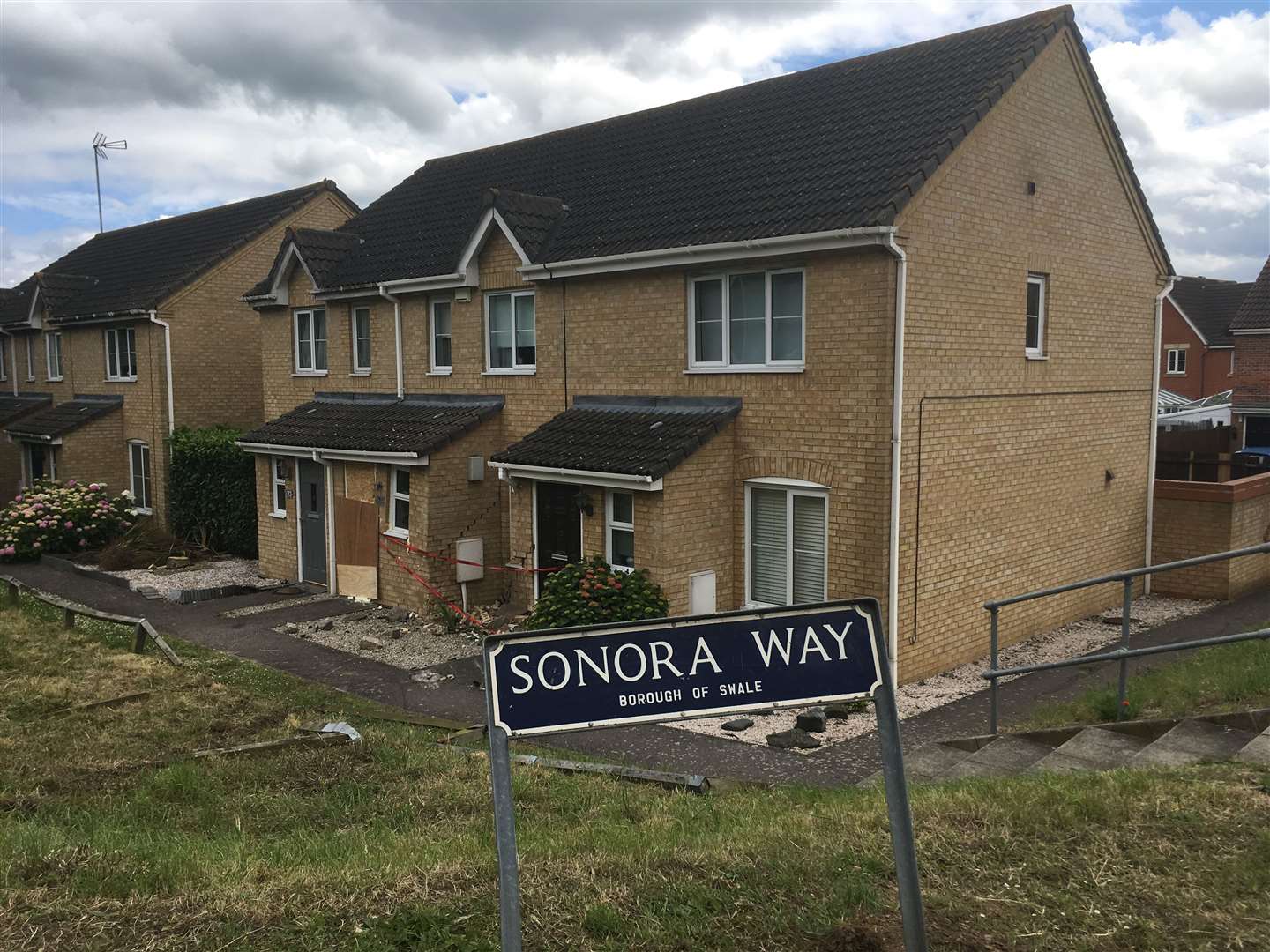A Vauxhall Astra car crashed into these houses in Quinton Road at the junction of Sonora Way in Sittingbourne (12397874)