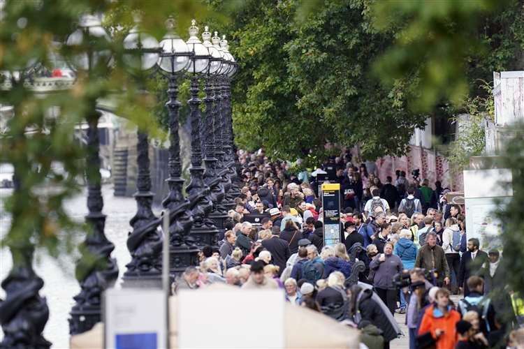 Members of the public wait in the queue near Lambeth Bridge in central London, to view Queen Elizabeth II lying in state. Picture: Danny Lawson/PA.