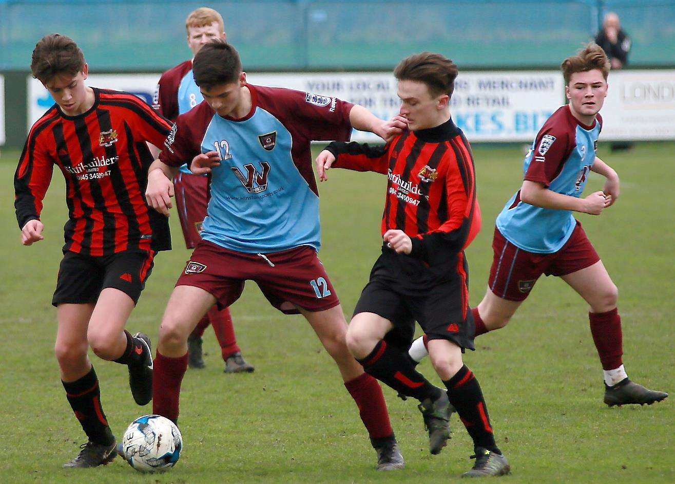 Wigmore Youth under-18s (claret/blue) take on Woodcoombe Youth United under-18s. Picture: Phil Lee FM1417634