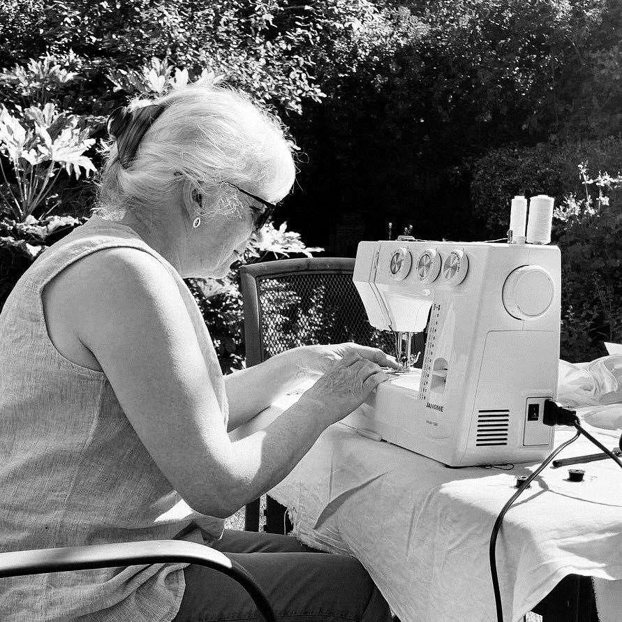 Pat Wilson took her sewing machine out into the garden to make the masks during the summer