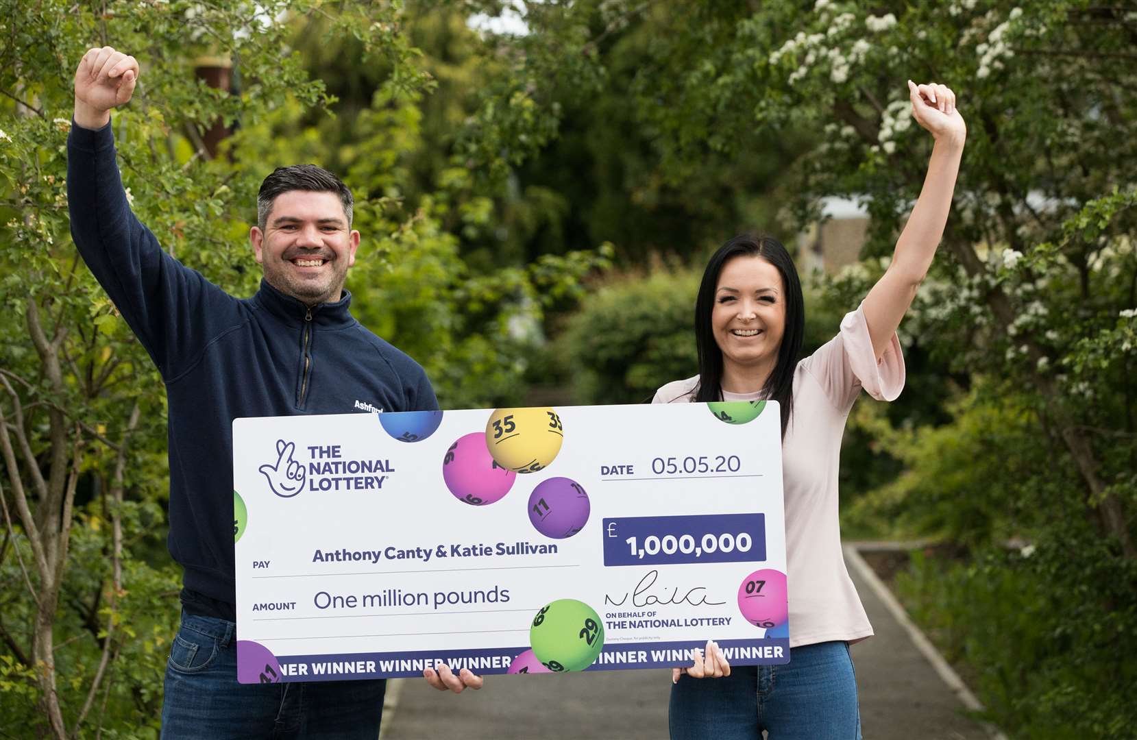 Anthony Canty celebrates with his partner Katie Sullivan (National Lottery/PA)