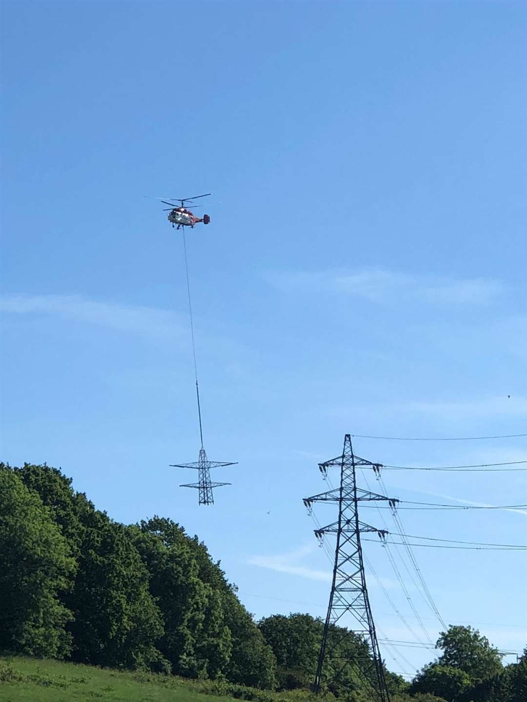 The Swiss Helirig KA-32 Kamov helicopter at work removing. Picture National Grid