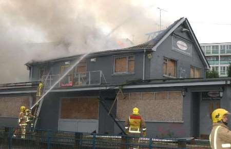 Firefighters battle to bring the blaze under control. Picture: BARRY CRAYFORD
