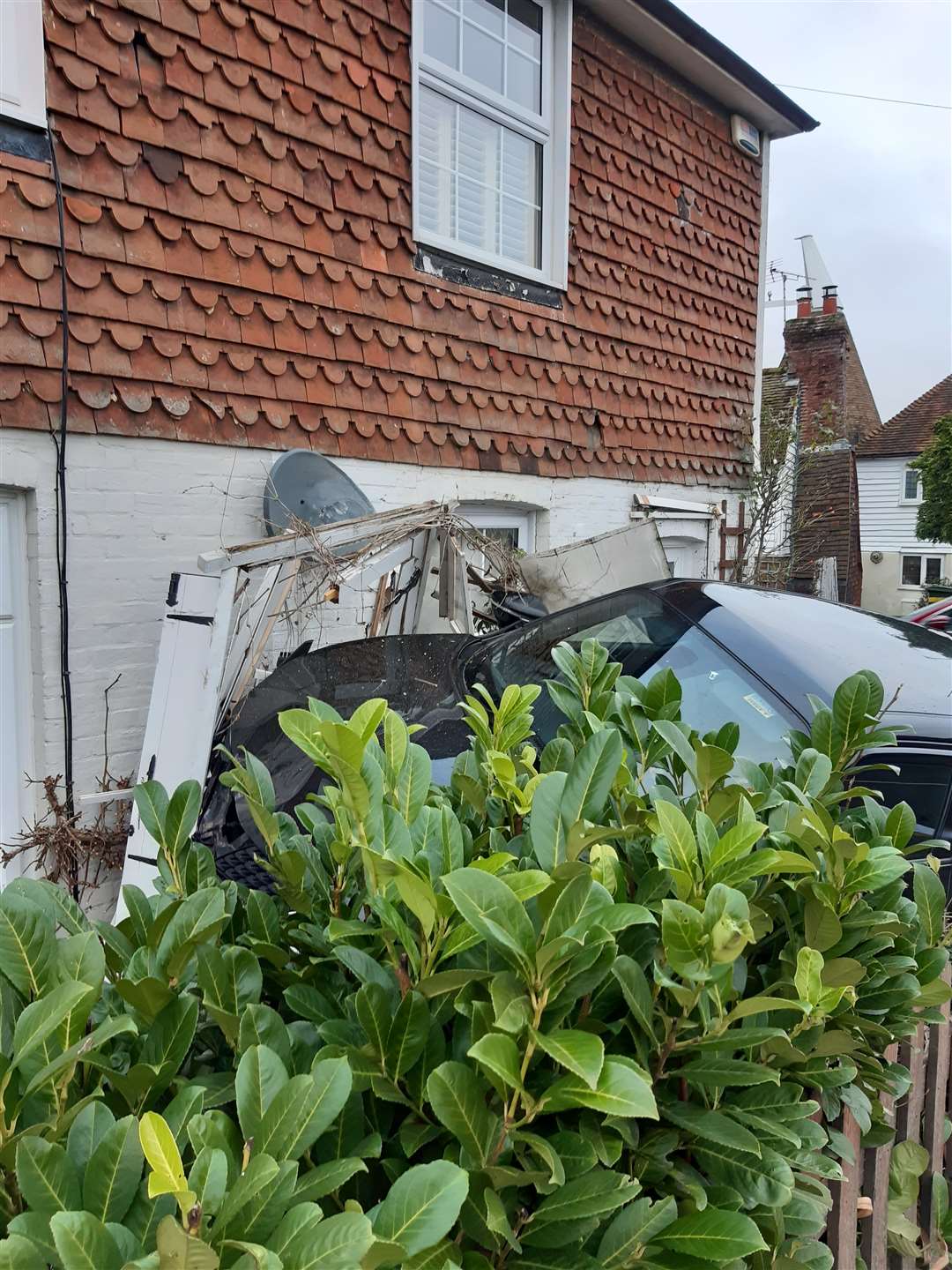 Car crashed into house at junction of Wheeler Street and Oak Lane, Headcorn