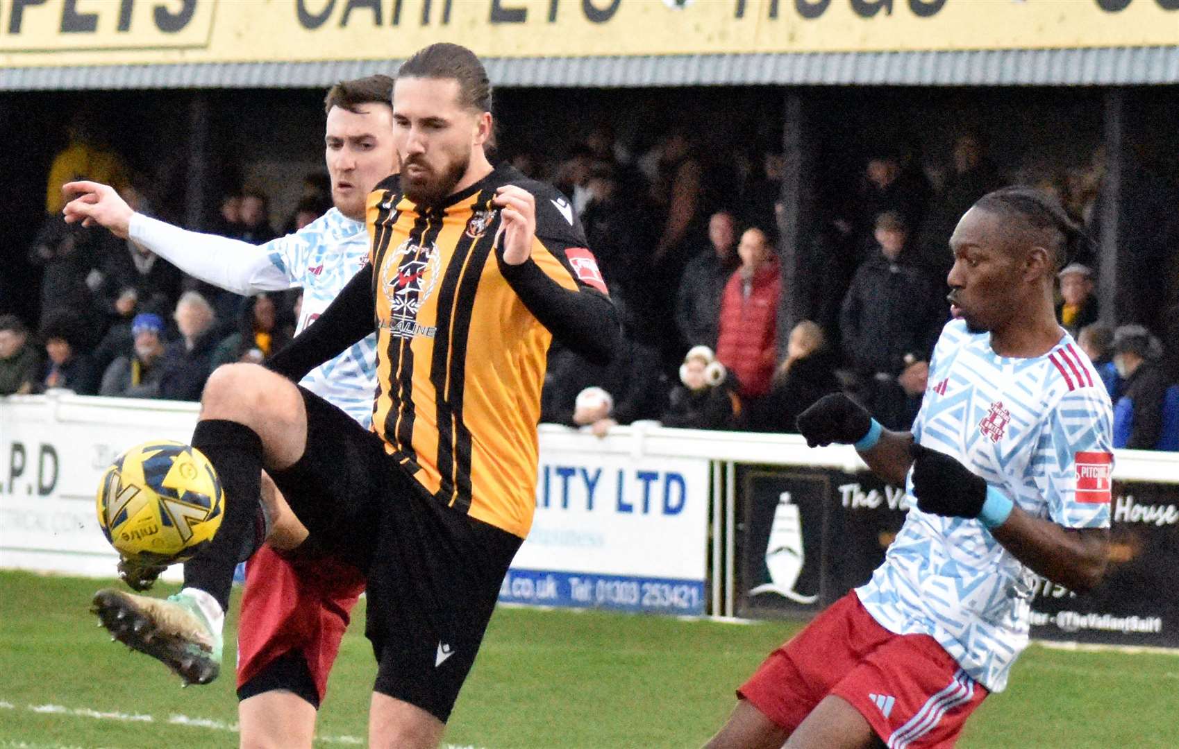Folkestone scorer Tom Derry is challenged for possession by Hashtag United during Saturday’s 3-1 defeat. Picture: Randolph File