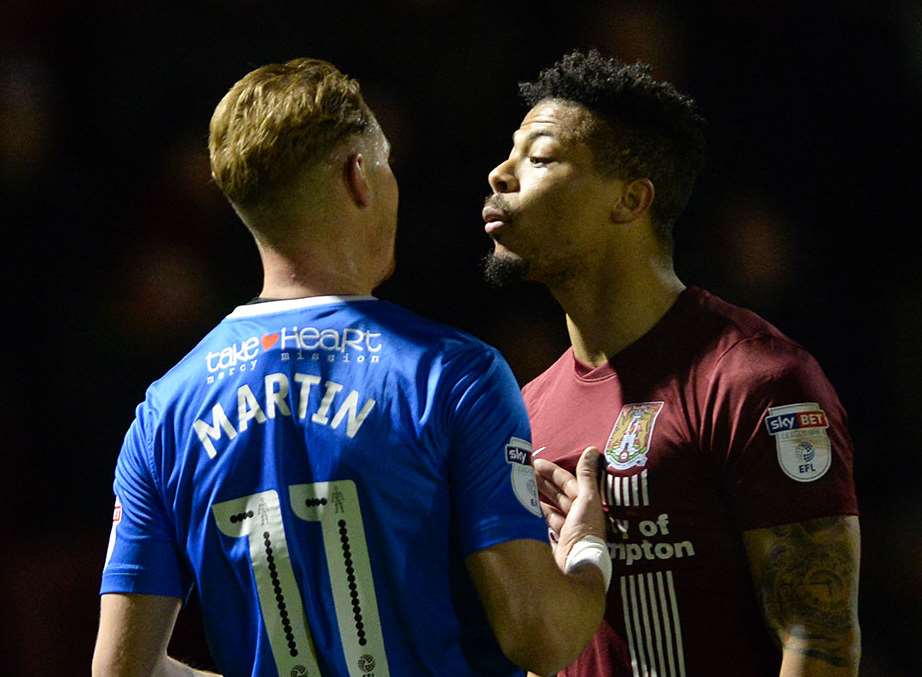 Northampton's Hildeberto Pereira confronts Lee Martin before being sent off after the final whistle is blown Picture: Ady Kerry