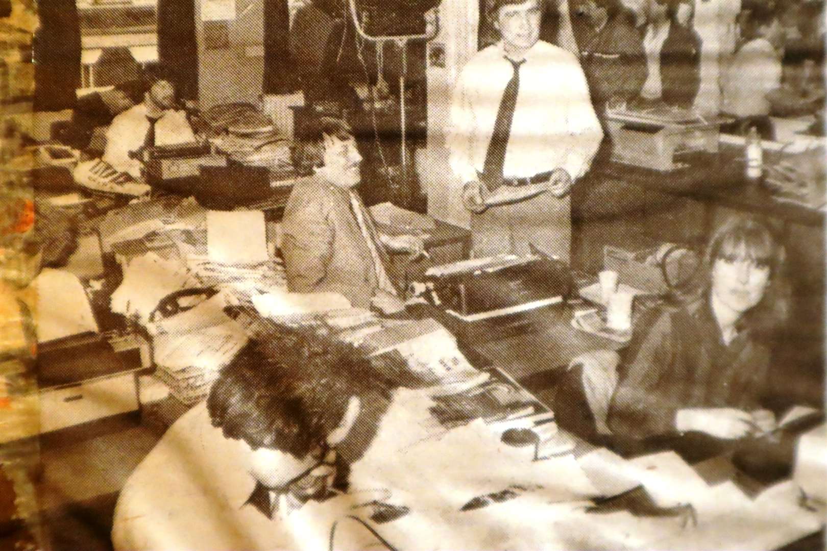 Peter Tilbury as editor Malcolm Proby gets some tips from reporters while filming the TVS drama CATS Eyes in the Kent Evening Post's offices in Chatham High Street in March 1985. In the picture are Carolyn Henderson, Malcolm Triggs, Graham Cole, Ian Read and Teresa Driscoll