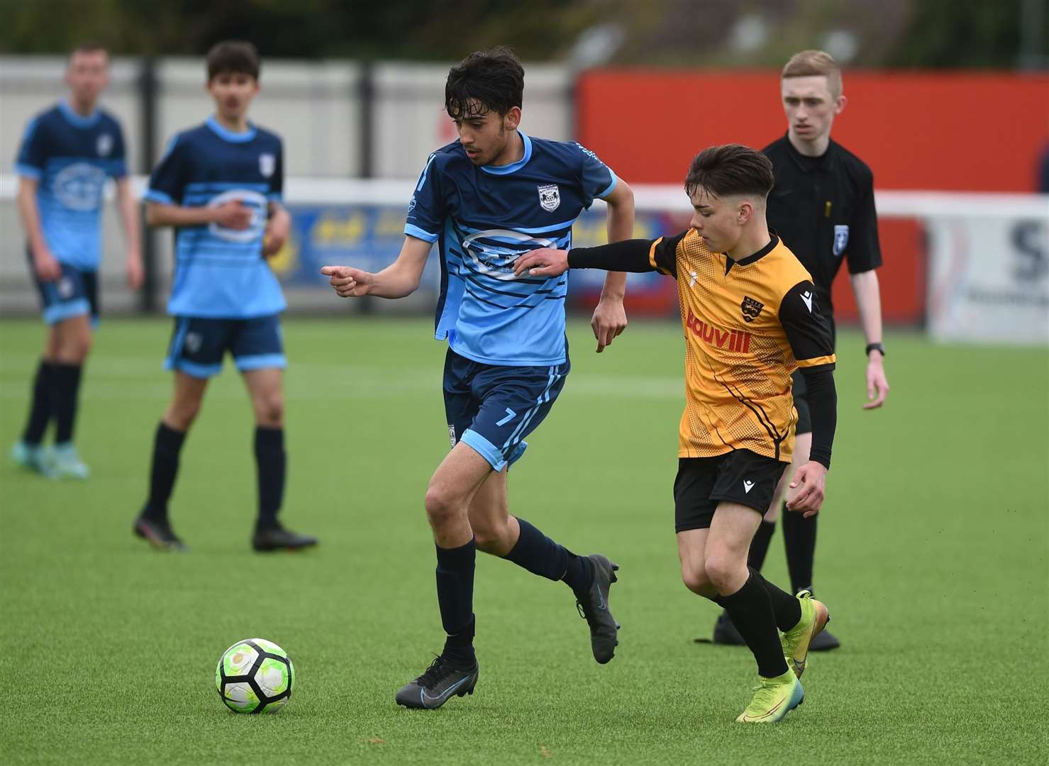 Rochester City under-14s (blue) hold off the attentions of Maidstone United under-14s. Picture: PSP Images