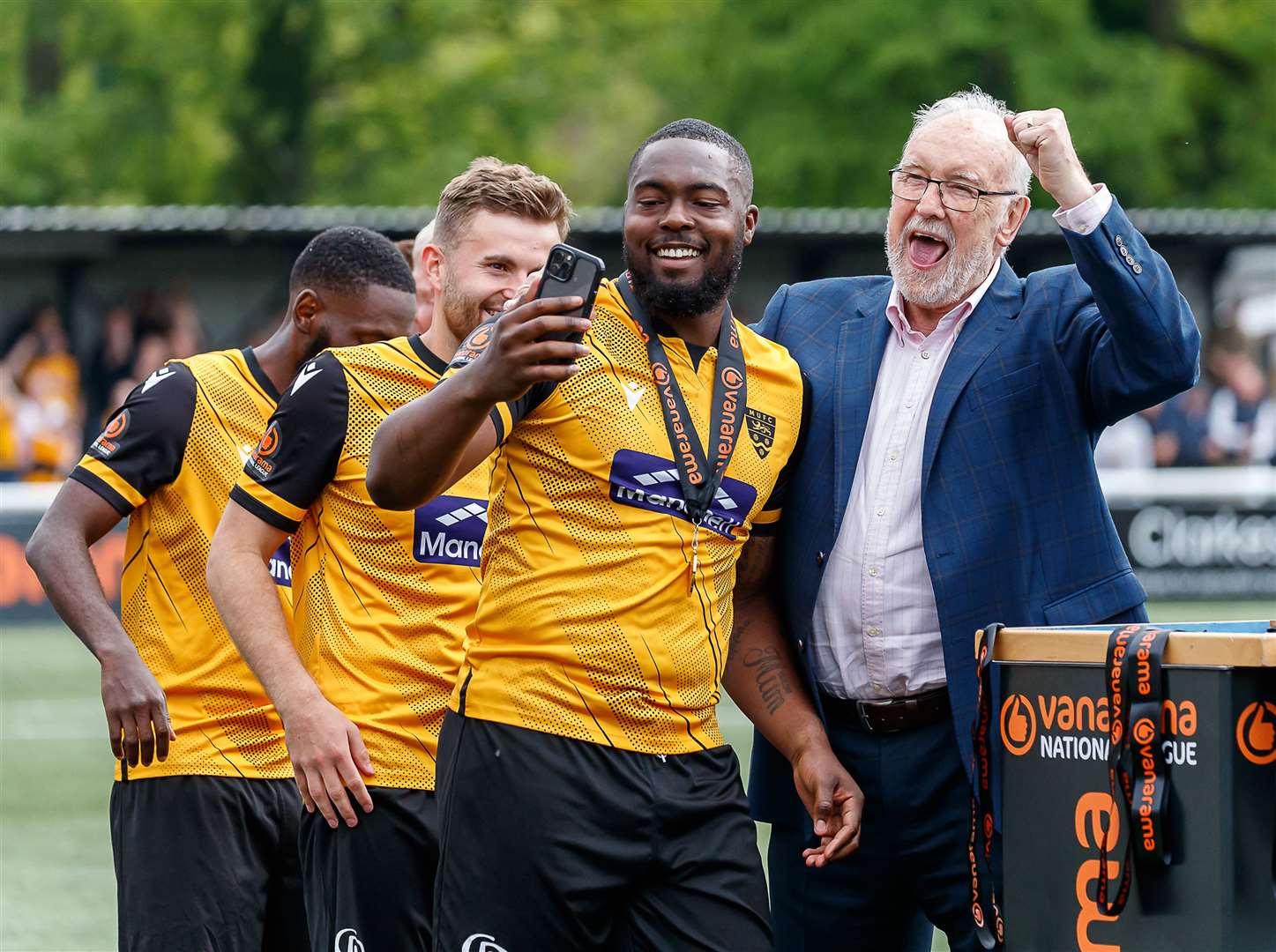Jerome Binnom-Williams celebrates Maidstone's National South title success with chief executive Bill Williams. Picture: Helen Cooper