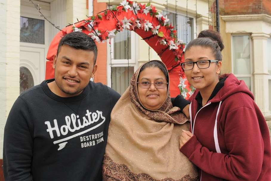 An archway was put up in Halfway Road, Halfway, to celebrate the wedding of Rezwana Islam and Shaful Khan. She is pictured here with her brother Ashraful Islam and Firuza Khatun.
