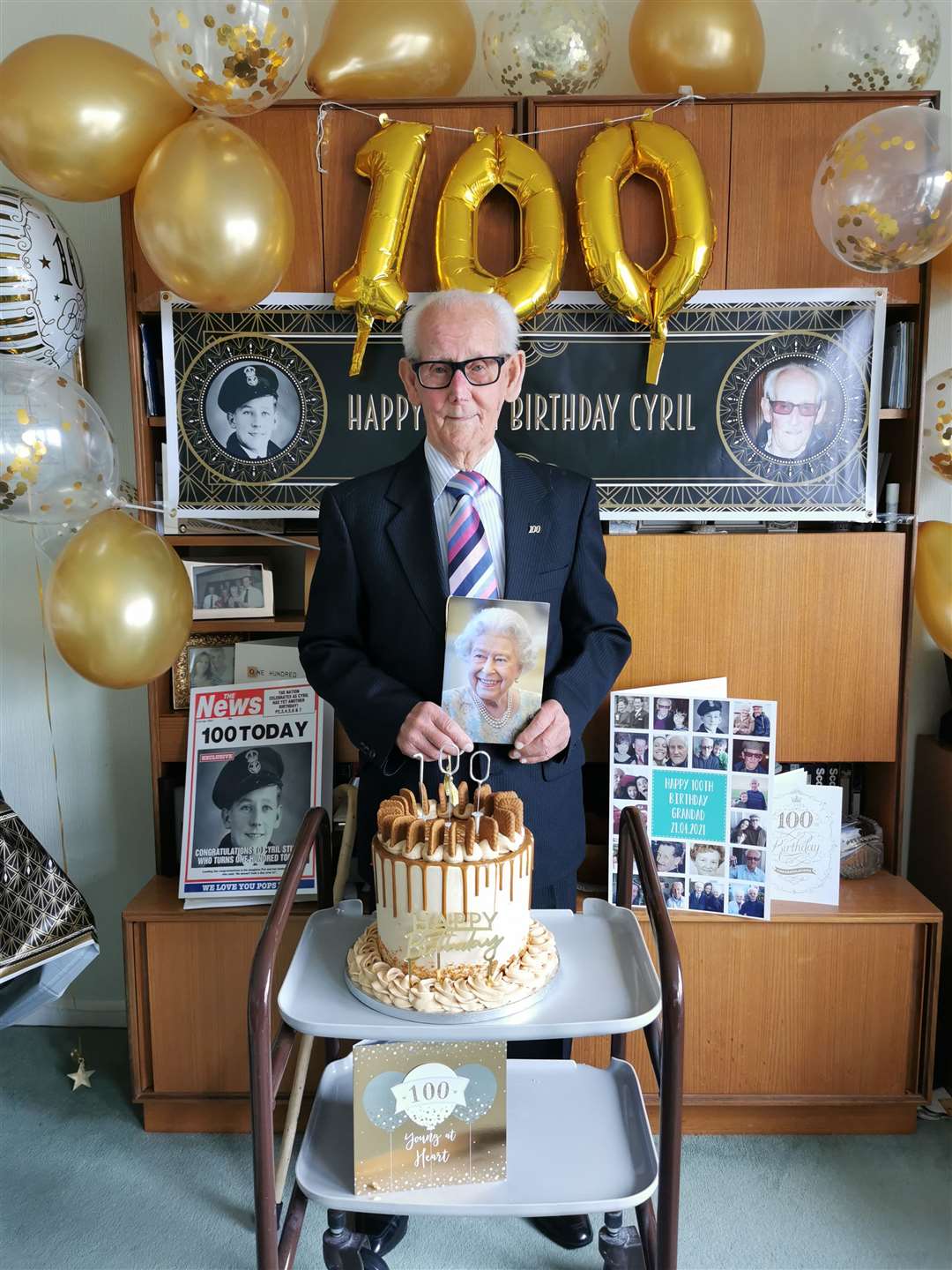 Cyril Stuart celebrates his 100th birthday with cards, balloons, cake and his military memories