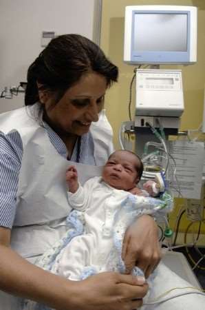 Staff nurse Maniben Mistry with abandoned baby Matthew at the William Harvey Hospital