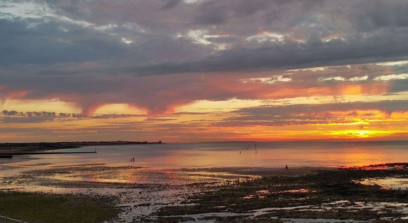 The setting sun breaks through the clouds. Pic: Ian Noble.