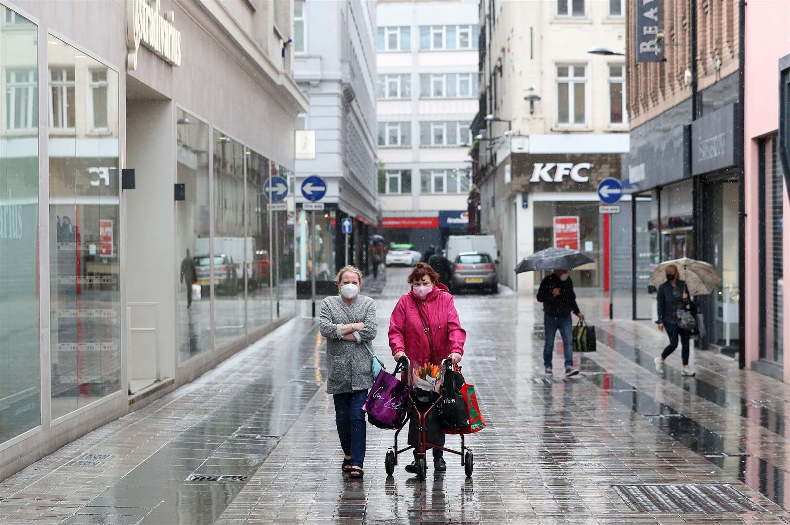Shoppers in Belfast after shopping centres and retailers were given the green light to reopen (Brian Lawless/PA)