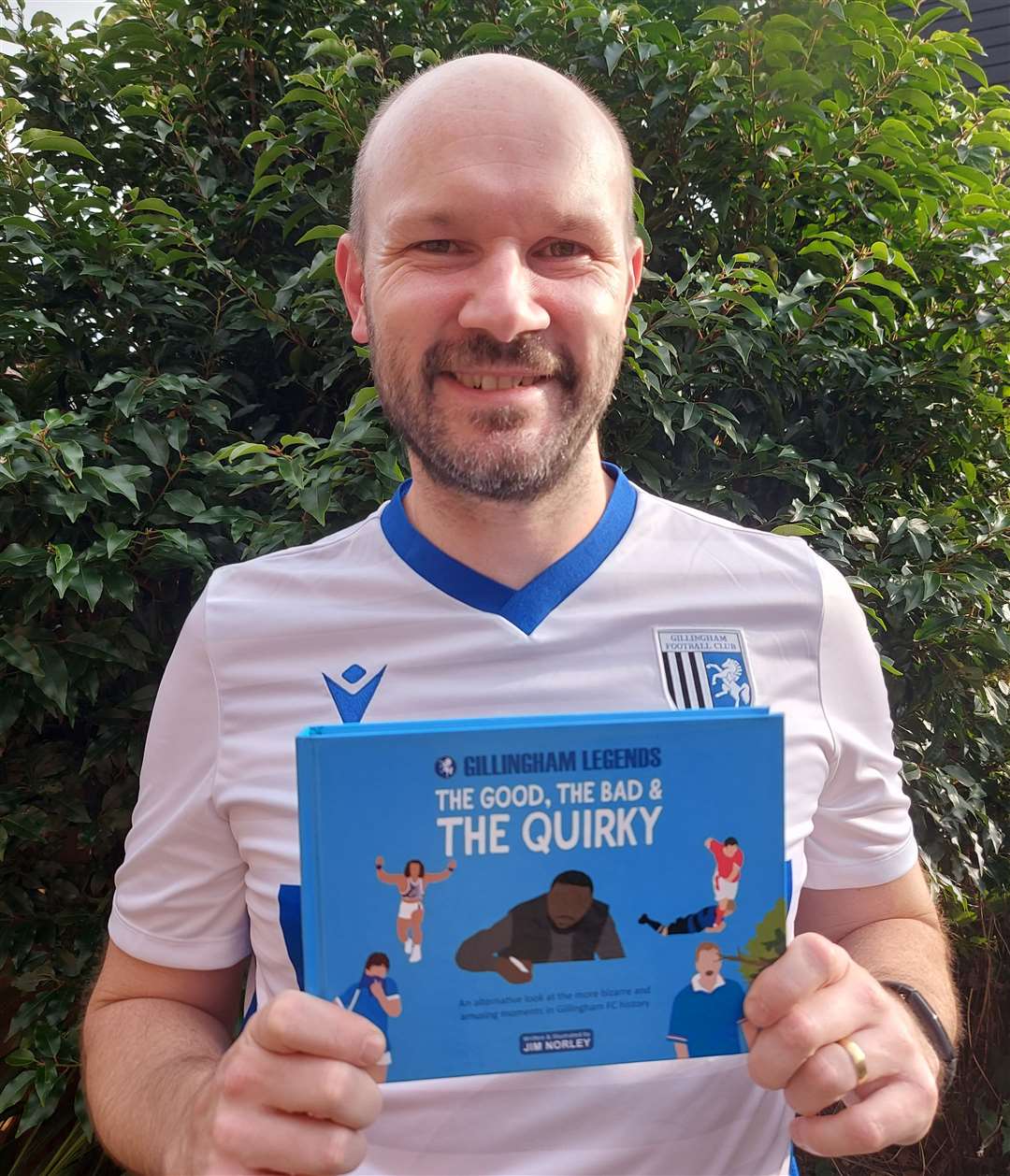 Life-long Gills fan Jim Norley with his new book. Picture: Jim Norley