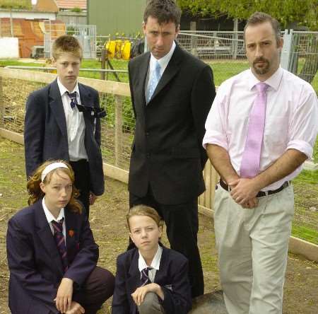 Pupils Beau, Emma and Megan with head teacher Jon Whitcombe and farm leader Matthew Hodgson. Picture: ANDY PAYTON