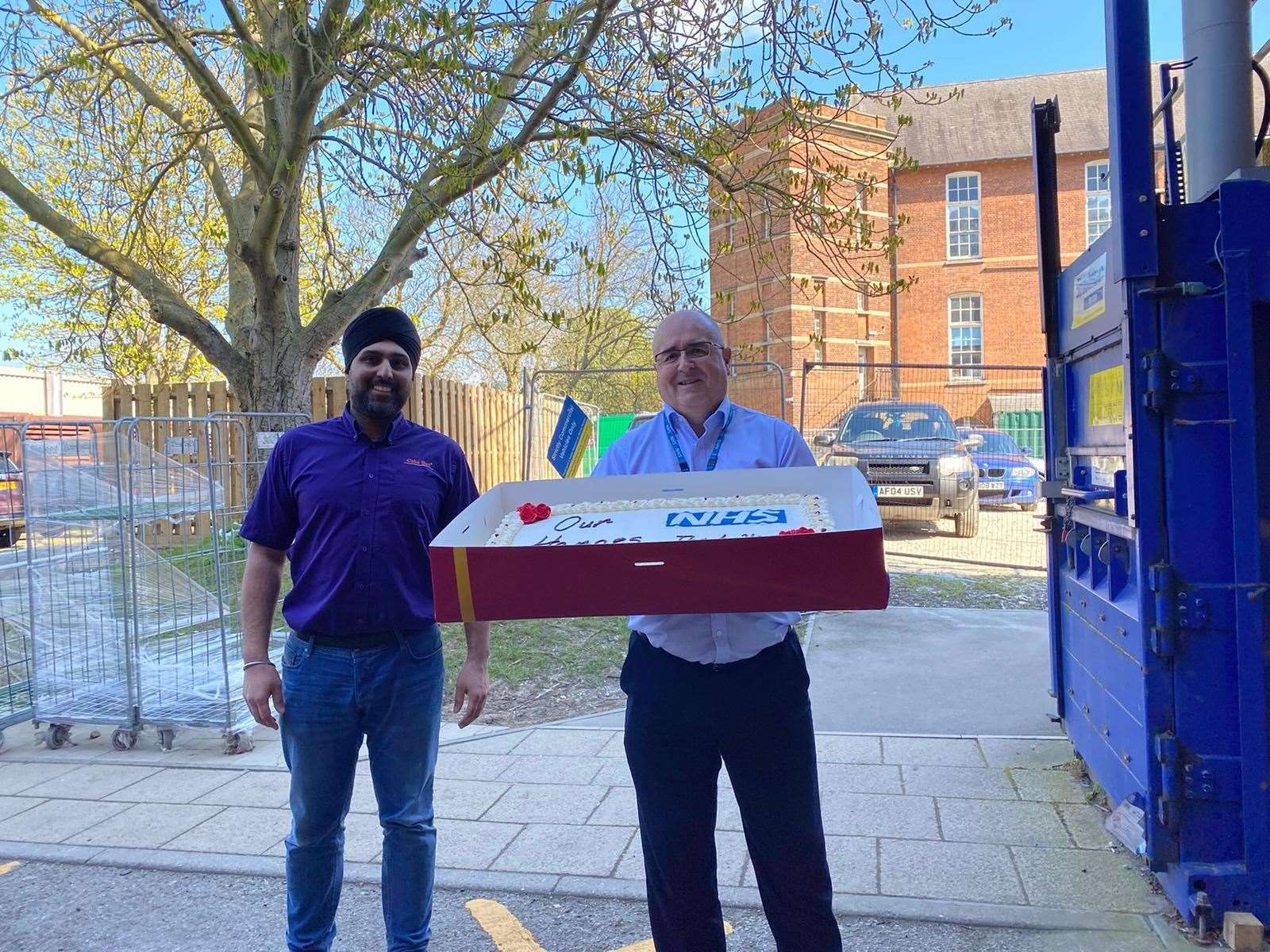 Shelinder Bhurji, owner of Eggfree Cake Box with Gary Lupton executive director of estates and facilities at Medway Maritime Hospital