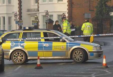Police officers at the scene of the incident in Chatham's New Road. Picture: BARRY CRAYFORD