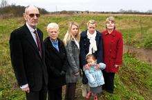 From left, in front of the site, are Town Mayor Cllr Jeff Andrews, Kathleen Andrews, Natalie Barker, Holli Read, with Olivia Godden, 3, and Val Dane