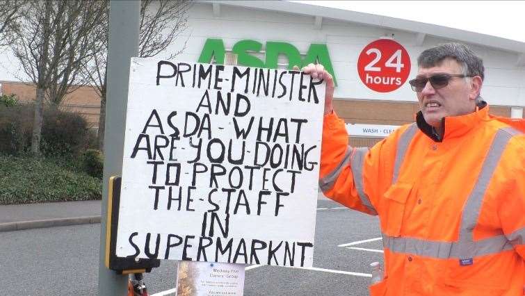 John Lawrence is protesting outside Chatham Asda to stop the abuse staff are facing