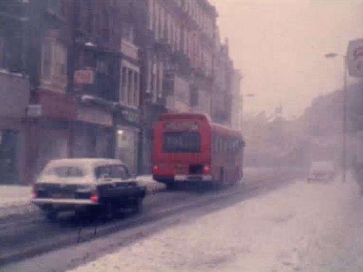 A bus and car negotiating treacherous conditions more than 40 years ago. Picture: Dover Museum