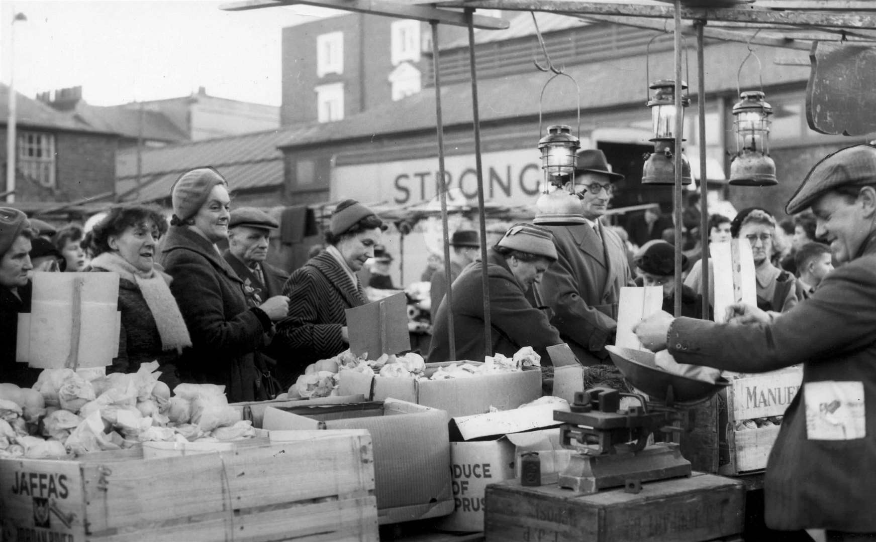 Saturday morning shoppers in Gravesend's open-air market in February 1959