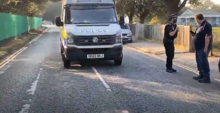 Police at Napier Barracks last month, after a group of people gathered outside the gates appearing to protest that asylum seekers moved in. Picture from Youtube account: Xx T W xX