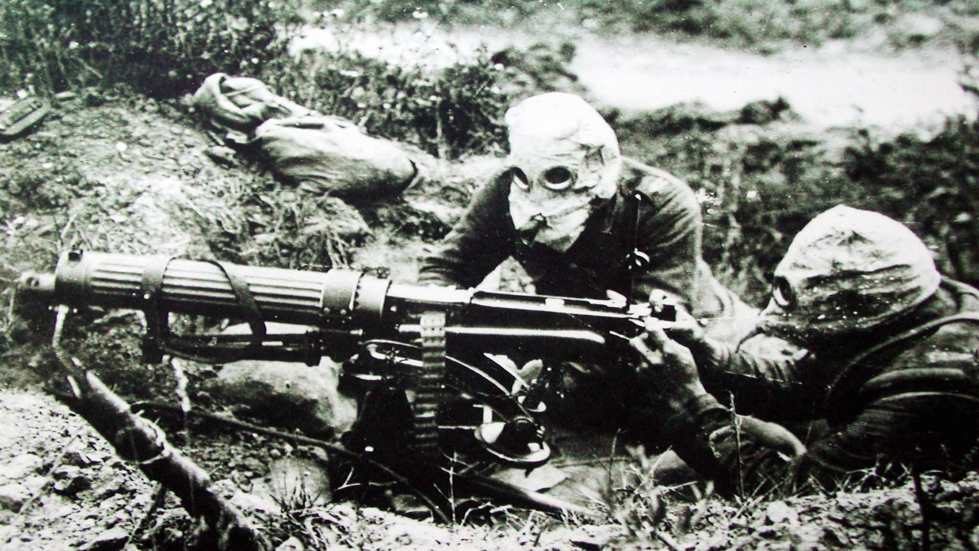 British machine gunners wearing gas masks in the Battle of the Somme.