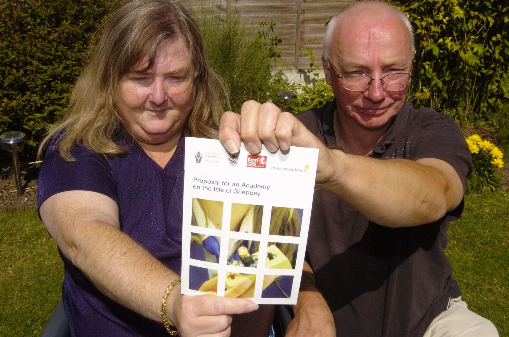 Theresa Langworthy and Tony Batchelor with the consultation document being sent to each Sheppey household for the Island's proposed academy in 2006. Picture: Andy Payton